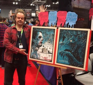 Larry Fessenden at NYC Comic Con with specialty posters of a couple of his films.